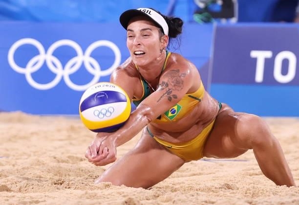 Agatha Bednarczuk of Team Brazil competes against Team China during the Women's Preliminary - Pool C beach volleyball on day four of the Tokyo 2020...