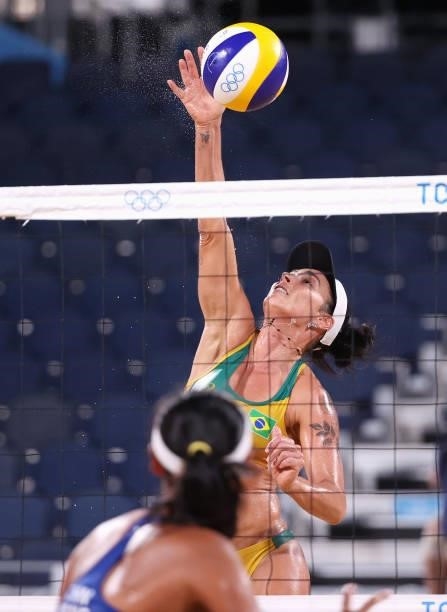 Agatha Bednarczuk of Team Brazil competes against Team China during the Women's Preliminary - Pool C beach volleyball on day four of the Tokyo 2020...