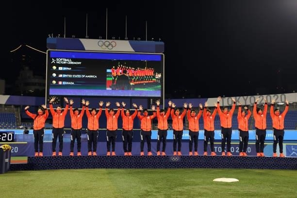 Team Japan takes the stage to receive their gold medals after defeating Team United States 2-0 in the Softball Gold Medal Game between Team Japan and...