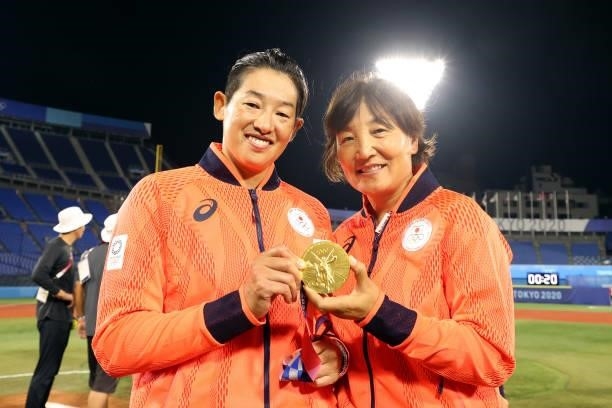 Manager Reika Utsugi and Yukiko Ueno of Team Japan pose with their gold medals after defeating Team United States 2-0 in the Softball Gold Medal Game...