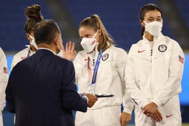 Haylie McCleney of Team United States receives her silver medal after losing 2-0 to Team Japan in the Softball Gold Medal Game on day four of the...