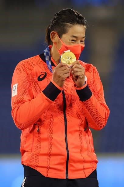 Yukiko Ueno of Team Japan stands on the podium after receiving her gold medal following a 2-0 victory over the United States in the Softball Gold...