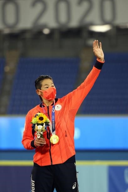 Yukiko Ueno of Team Japan stands on the podium after receiving her gold medal following a 2-0 victory over the United States in the Softball Gold...