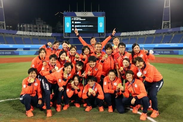 Team Japan poses for a team photo with their gold medals after defeating Team United States 2-0 in the Softball Gold Medal Game between Team Japan...