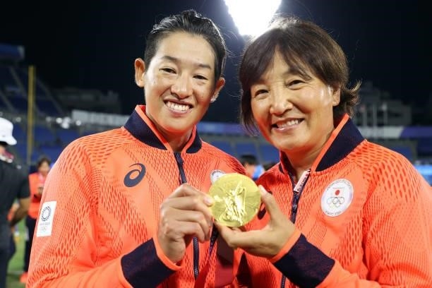 Manager Reika Utsugi and Yukiko Ueno of Team Japan pose with their gold medals after defeating Team United States 2-0 in the Softball Gold Medal Game...