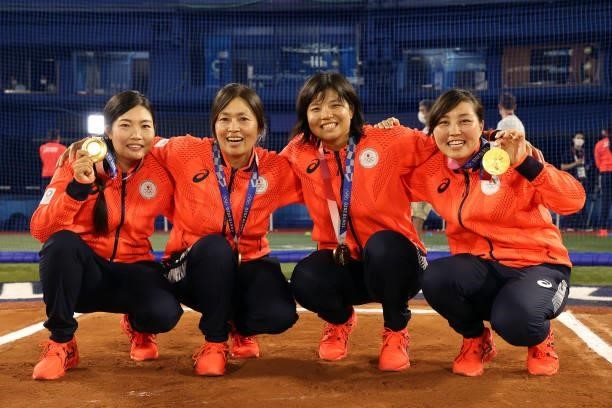 Members of Team Japan pose with their gold medals after defeating Team United States 2-0 in the Softball Gold Medal Game between Team Japan and Team...