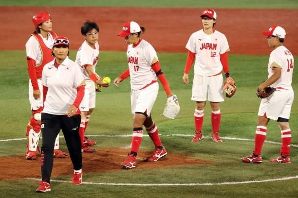 Yukiko Ueno of Team Japan leaves the game in the sixth inning during the Softball Gold Medal Game between Team Japan and Team United States on day...