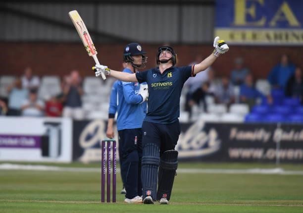 Ed Pollock of Warwickshire celebrates reaching his 100 during the Royal London Cup match between Derbyshire and Warwickshire at The Incora County...