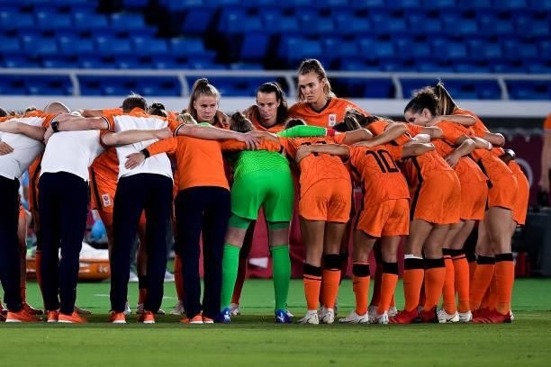Victoria Pelova of the Netherlands, Renate Jansen of the Netherlands and Jill Roord of the Netherlands look on while forming a huddle with their team...