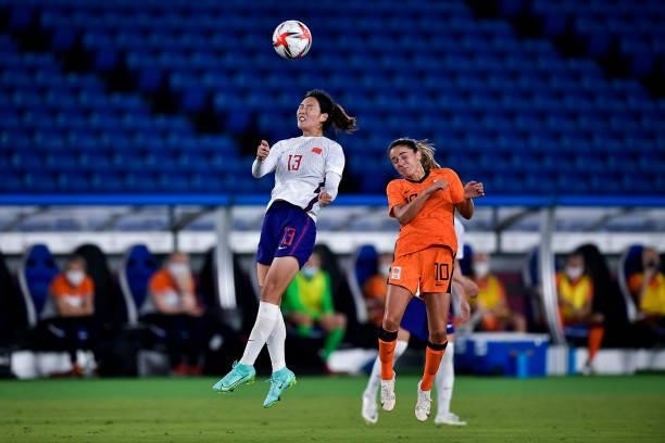Lina Yang of China competes for the headed ball with Danielle van de Donk of the Netherlands during the Tokyo 2020 Olympic Womens Football Tournament...