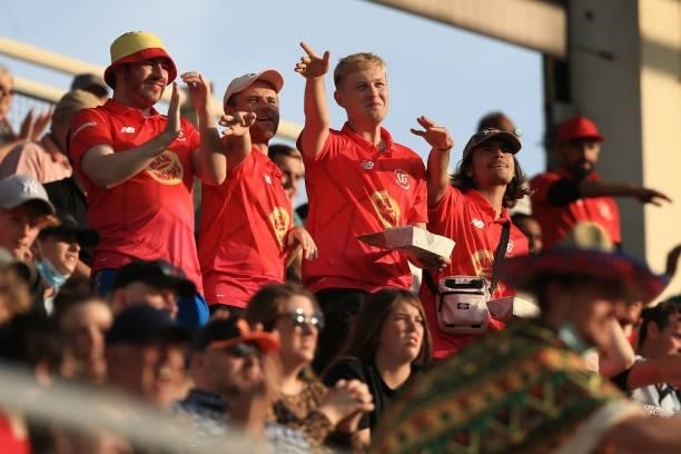 Fans of Welsh Fire enjoy themselves during The Hundred match between Welsh Fire and Southern Brave at Sophia Gardens on July 27, 2021 in Cardiff,...
