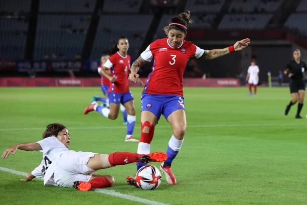 Mana Iwabuchi of Team Japan and Carla Guerrero of Team Chile battle for the ball the ball during the Women's Group E match between Chile and Japan on...