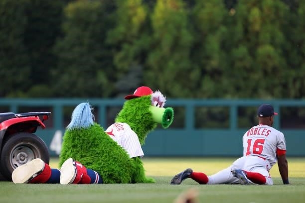 The Phillie Phanatic mimics Victor Robles of the Washington Nationals before a game against the Philadelphia Phillies at Citizens Bank Park on July...