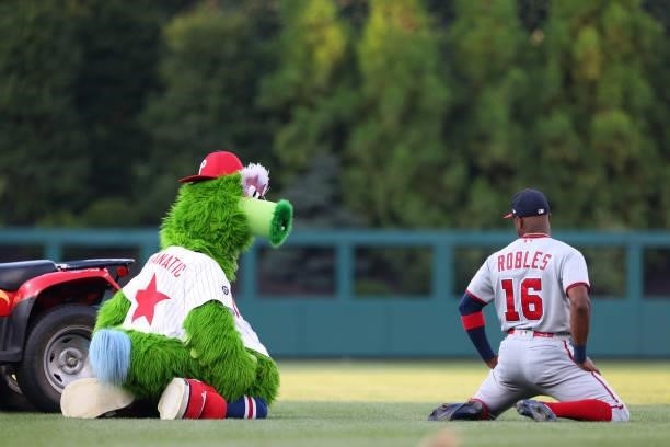 The Phillie Phanatic mimics Victor Robles of the Washington Nationals before a game against the Philadelphia Phillies at Citizens Bank Park on July...