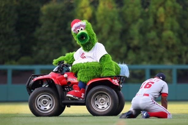 The Phillie Phanatic and Victor Robles of the Washington Nationals before a game against the Philadelphia Phillies at Citizens Bank Park on July 26,...