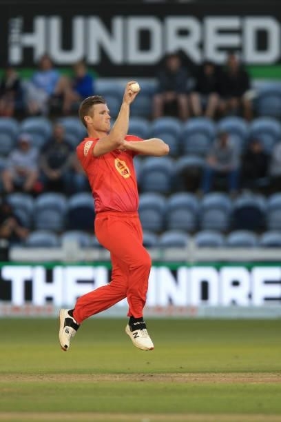 Jimmy Neesham of Welsh Fire bowls during The Hundred match between Welsh Fire and Southern Brave at Sophia Gardens on July 27, 2021 in Cardiff, Wales.