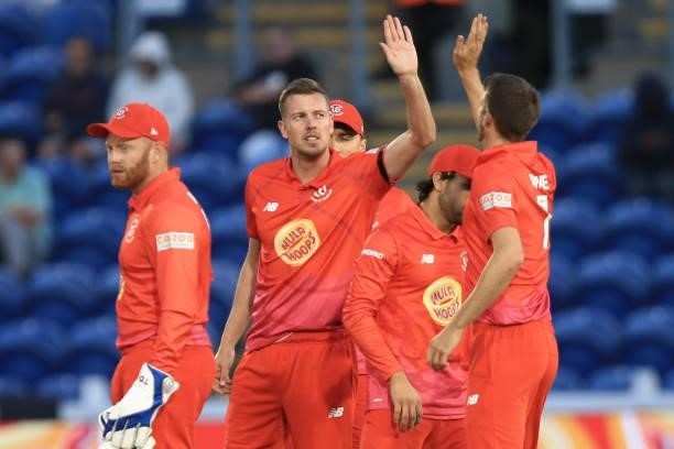 Jake Ball of Welsh Fire celebrates with teammates during The Hundred match between Welsh Fire and Southern Brave at Sophia Gardens on July 27, 2021...