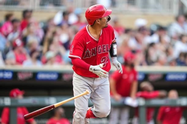 Kurt Suzuki of the Los Angeles Angels bats and hits a home run against the Minnesota Twins on July 23, 2021 at Target Field in Minneapolis, Minnesota.