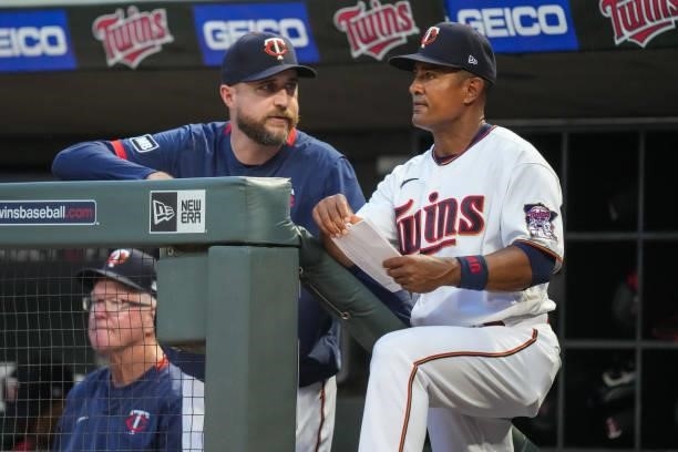 Manager Rocco Baldelli of the Minnesota Twins looks on with Tony Diaz against the Los Angeles Angels on July 23, 2021 at Target Field in Minneapolis,...