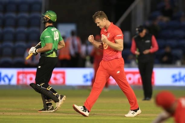 Jimmy Neesham of Welsh Fire picks up the wicket of Ross Whiteley of Southern Brave during The Hundred match between Welsh Fire and Southern Brave at...