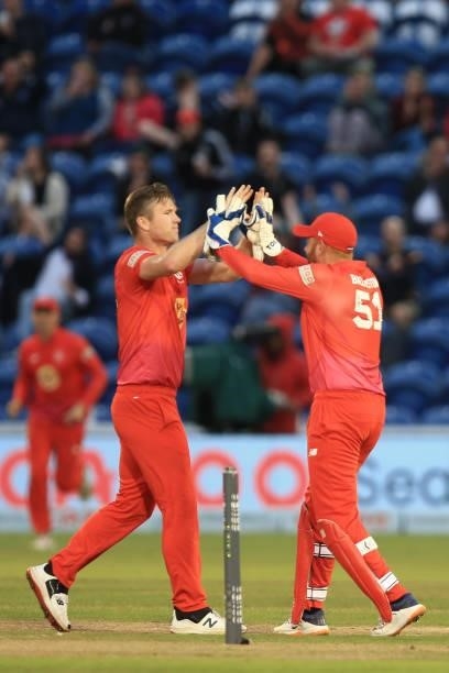 Jimmy Neesham and Jonny Bairstow of Welsh Fire during The Hundred match between Welsh Fire and Southern Brave at Sophia Gardens on July 27, 2021 in...