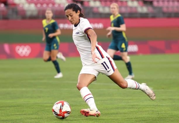 Christen Press of Team United States prepares to kick the ball against Australia during the Women's Football Group G match on day four of the Tokyo...