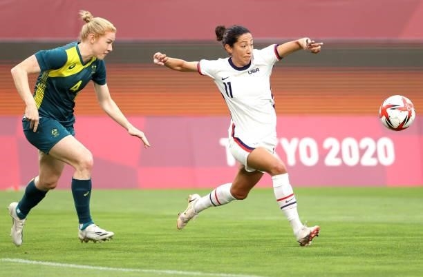 Christen Press of Team United States plays against Clare Polkinghorne of Team Australia during the Women's Football Group G match on day four of the...