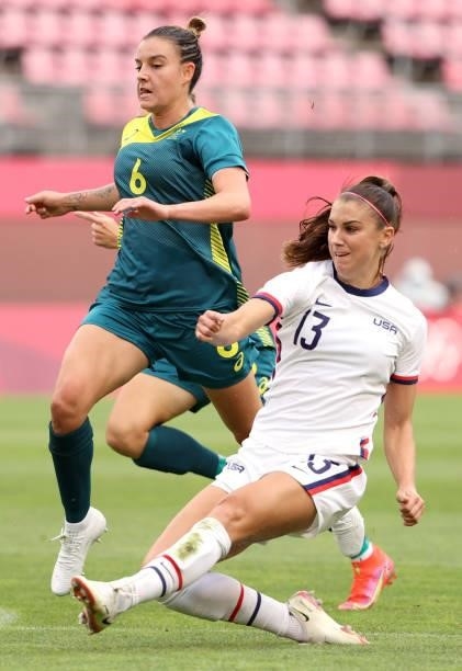 Alex Morgan of Team United States plays against Chloe Logarzo of Team Australia during the Women's Football Group G match on day four of the Tokyo...
