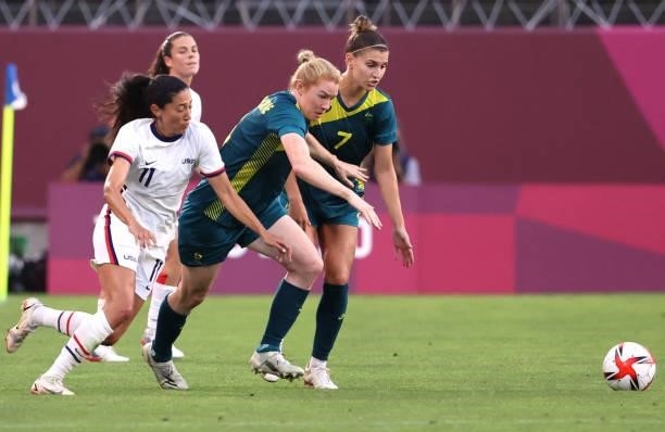 Christen Press of Team United States chases Clare Polkinghorne of Team Australia during the Women's Group G match on day four of the Tokyo 2020...