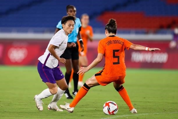 Wang Shuang of China competes for the ball in the Women's First Round match during the Tokyo 2020 Olympic Games between Netherland and China at...