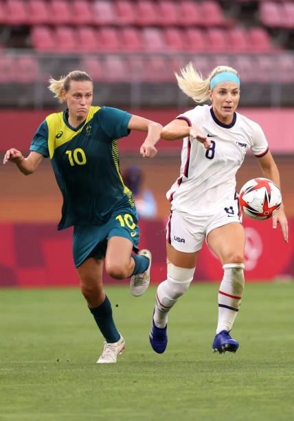 Emily Van Egmond of Team Australia battles with Julie Ertz of Team United States during the Women's Group G match on day four of the Tokyo 2020...