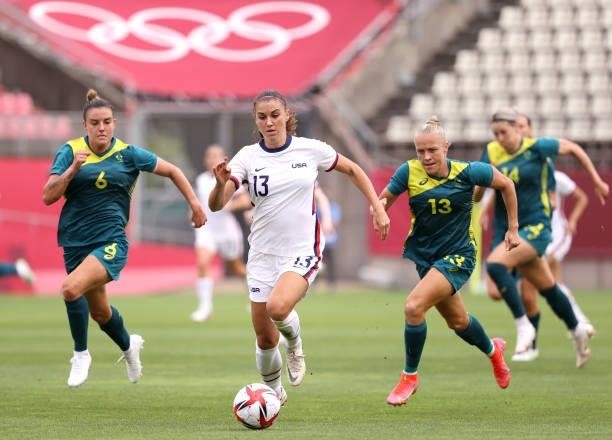 Alex Morgan of Team United States chases down the ball against Australia during the Women's Group G match on day four of the Tokyo 2020 Olympic Games...