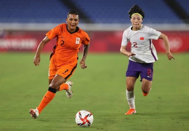 Shanice van de Sanden of Team Netherlands breaks away from Mengwen Li of Team China during the Women's Group F match between China and Neterlands on...