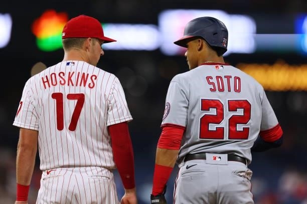 Rhys Hoskins of the Philadelphia Phillies and Juan Soto of the Washington Nationals during a game at Citizens Bank Park on July 26, 2021 in...