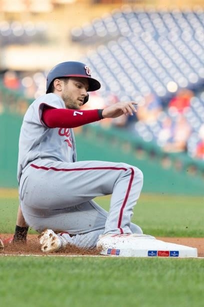 Trea Turner of the Washington Nationals slides into third base against the Philadelphia Phillies at Citizens Bank Park on July 27, 2021 in...