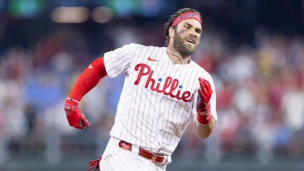 Bryce Harper of the Philadelphia Phillies runs to third base on his way to an inside-the-park home run in the bottom of the fifth inning against the...