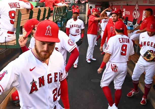 Los Angeles Angels players get ready for the game gainst the Colorado Rockies at Angel Stadium of Anaheim on July 26, 2021 in Anaheim, California.