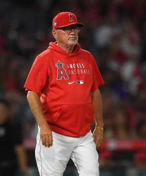 Manager Joe Maddon of the Los Angeles Angels walks to the pitching mound in the game against the Colorado Rockies at Angel Stadium of Anaheim on July...