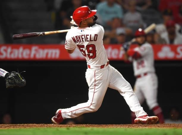 Jack Mayfield of the Los Angeles Angels hits a two run home run in the seventh inning of the game against the Colorado Rockies at Angel Stadium of...