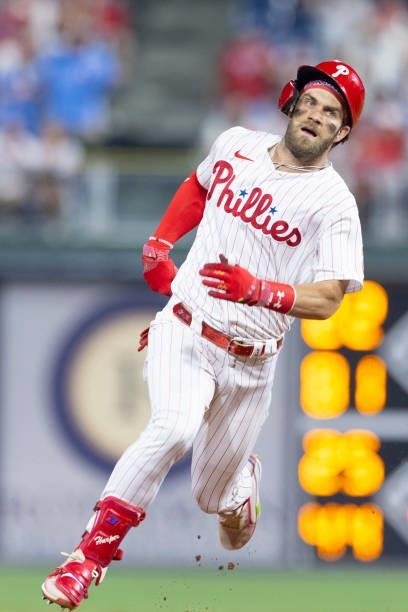 Bryce Harper of the Philadelphia Phillies runs to third base on his way to an inside-the-park home run in the bottom of the fifth inning against the...
