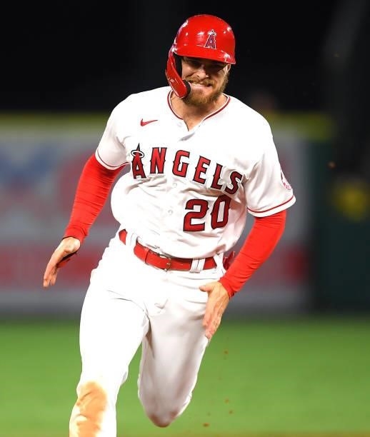Jared Walsh of the Los Angeles Angels grimaces as he rounds the bases in the game against the Colorado Rockies at Angel Stadium of Anaheim on July...
