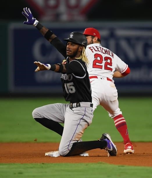 Raimel Tapia of the Colorado Rockies steals second in the game against the Los Angeles Angels at Angel Stadium of Anaheim on July 26, 2021 in...