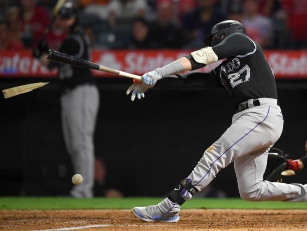 Trevor Story of the Colorado Rockies breaks his bat in the game against the Los Angeles Angels at Angel Stadium of Anaheim on July 26, 2021 in...