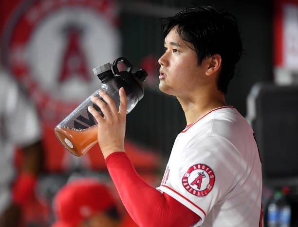 Shohei Ohtani of the Los Angeles Angels in the dugout during the game against the Colorado Rockies at Angel Stadium of Anaheim on July 26, 2021 in...