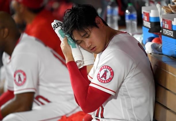 Shohei Ohtani of the Los Angeles Angels in the dugout during the game against the Colorado Rockies at Angel Stadium of Anaheim on July 26, 2021 in...