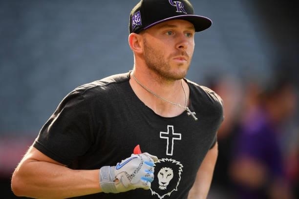 Trevor Story of the Colorado Rockies warms up before the game against the Los Angeles Angels at Angel Stadium of Anaheim on July 26, 2021 in Anaheim,...