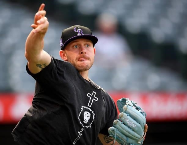 Trevor Story of the Colorado Rockies warms up before the game against the Los Angeles Angels at Angel Stadium of Anaheim on July 26, 2021 in Anaheim,...