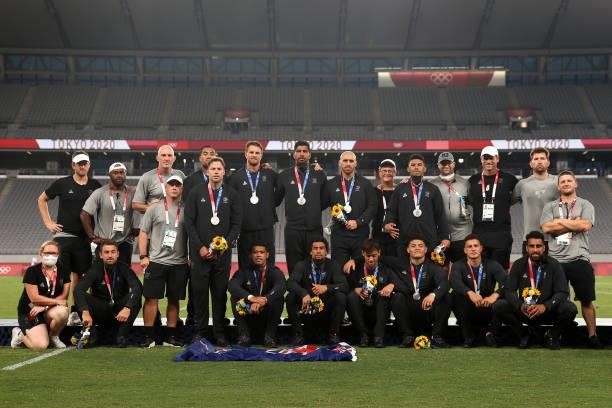 Team New Zealand pose for photographs after the Rugby Sevens Men's Gold Medal match between New Zealand and Fiji on day five of the Tokyo 2020...
