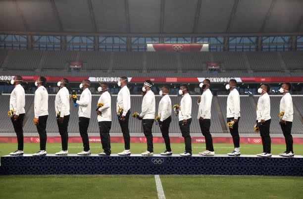 Team Fiji line up for the national anthem after winning the Rugby Sevens Men's Gold Medal match between New Zealand and Fiji on day five of the Tokyo...