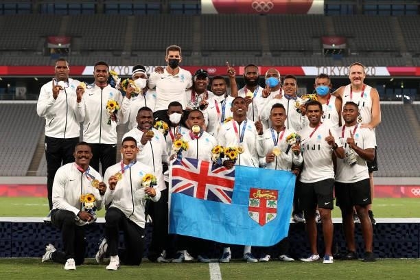 Team Fiji pose with their gold medals after winning the Rugby Sevens Men's Gold Medal match between New Zealand and Fiji on day five of the Tokyo...
